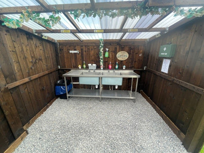 Covered outdoor washing-up area at Stag Park