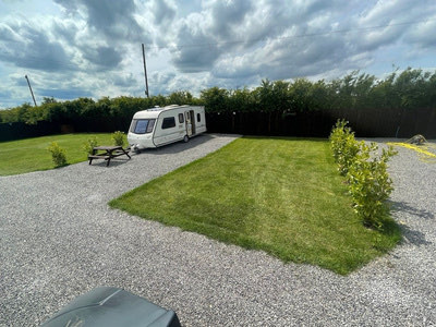 Gravel hard-standing pitches and new planting